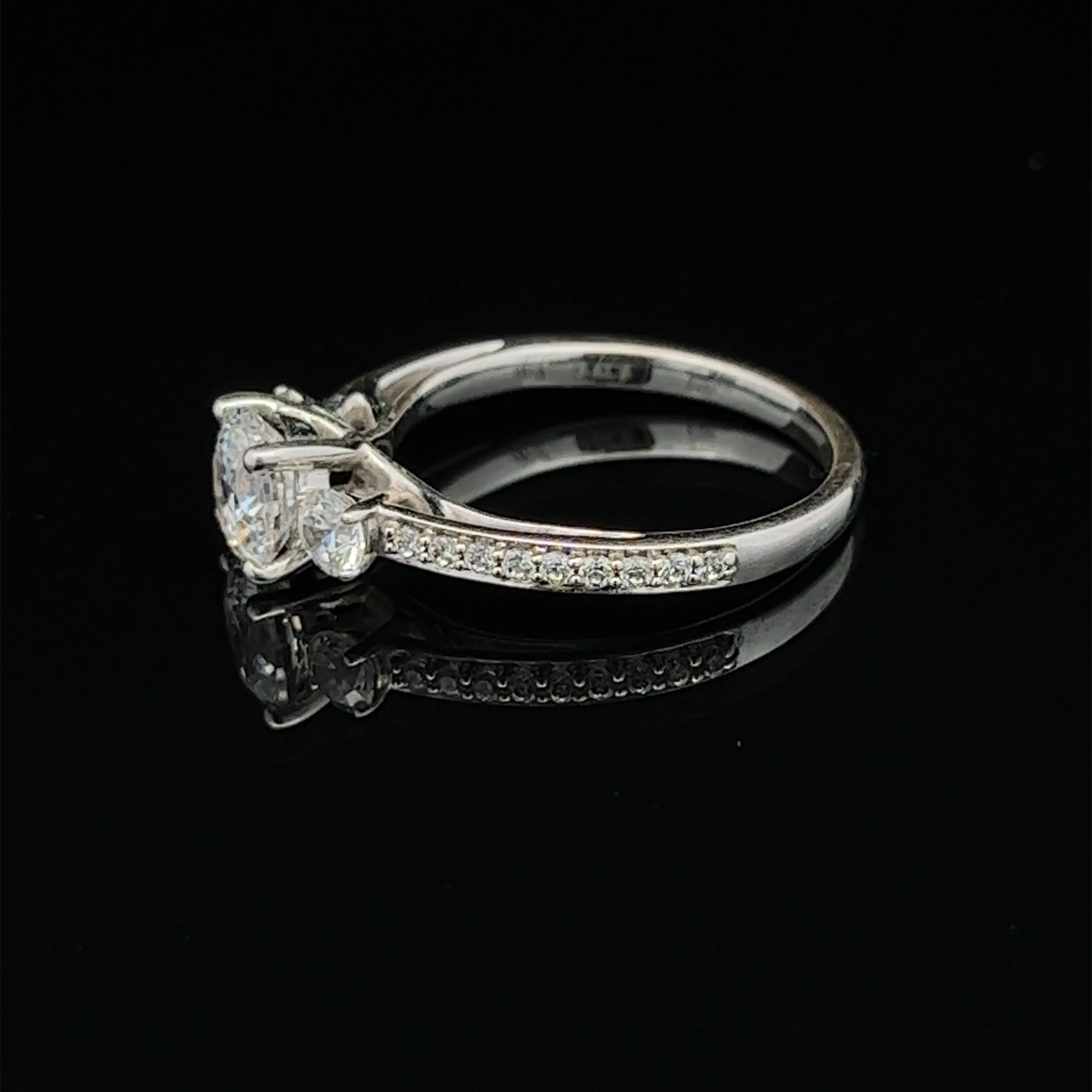 1 1/2 ctw three-stone round french-set diamond engagement ring