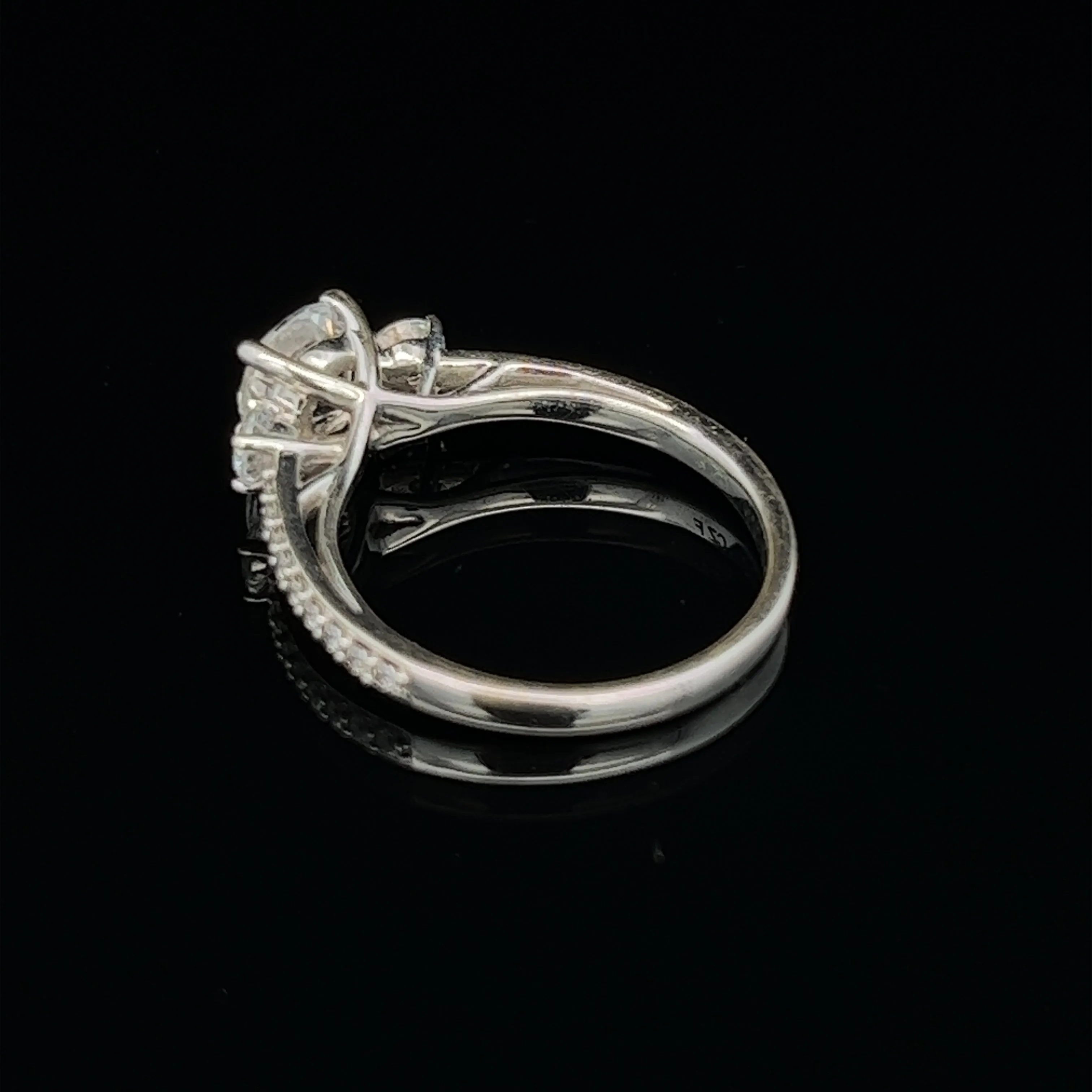 1 1/2 ctw three-stone round french-set diamond engagement ring