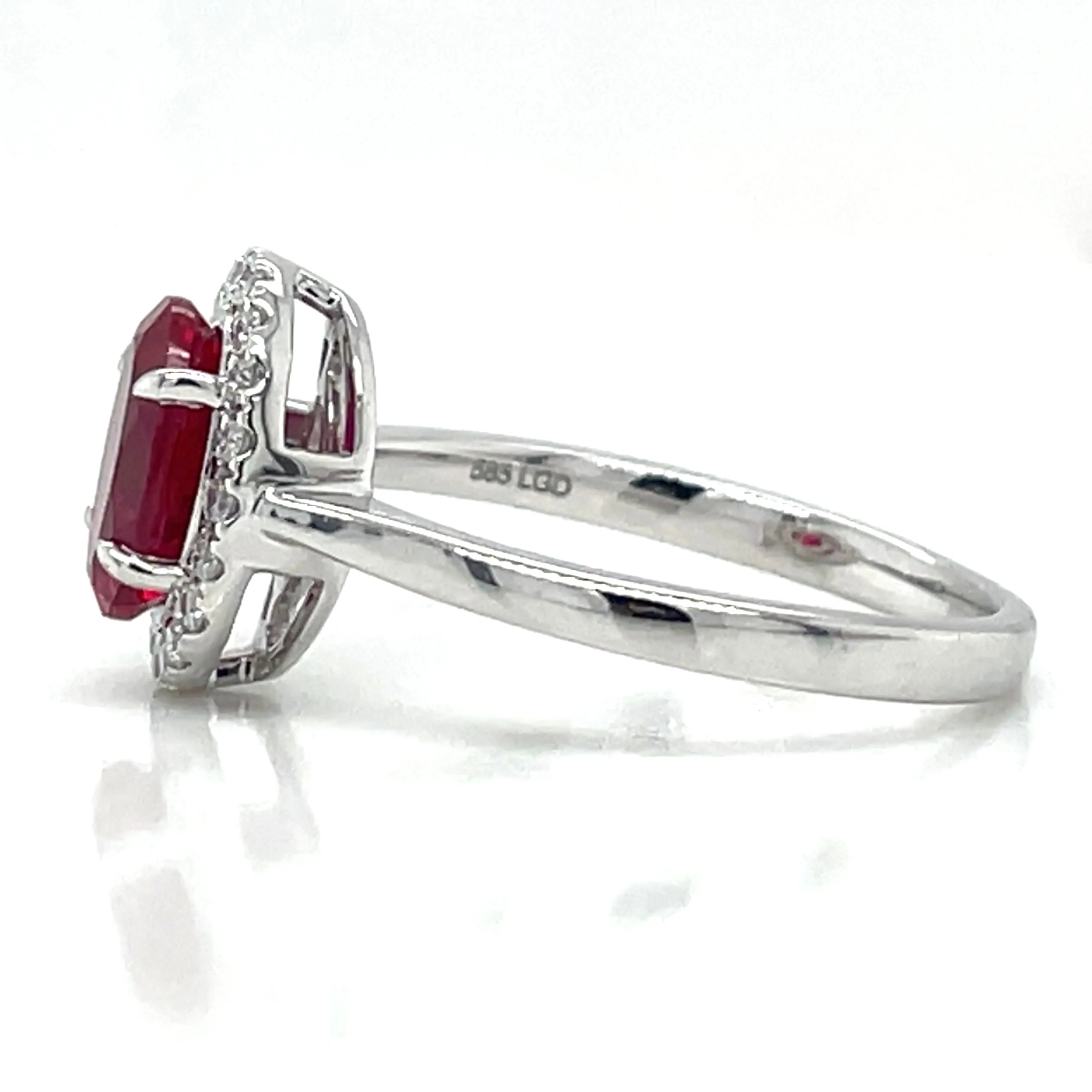 14ct White Gold Laboratory Grown 1.40ct Ruby And 0.15ct Diamond Halo Ring