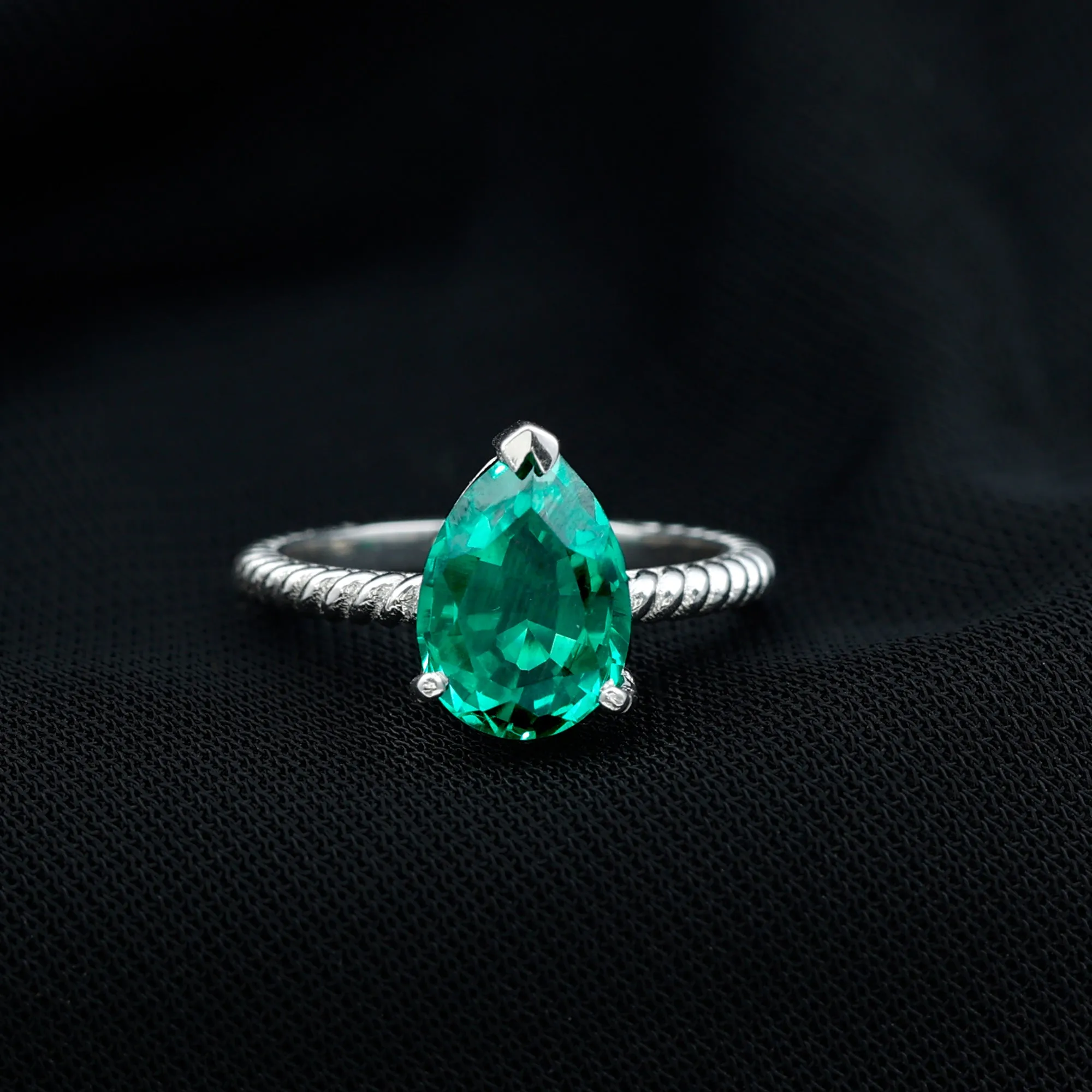 Created Emerald Solitaire Teardrop Ring with Hidden Moissanite