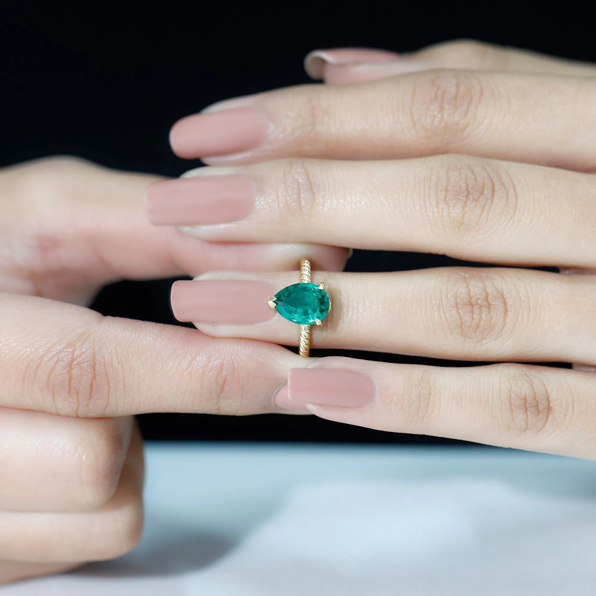 Created Emerald Solitaire Teardrop Ring with Hidden Moissanite
