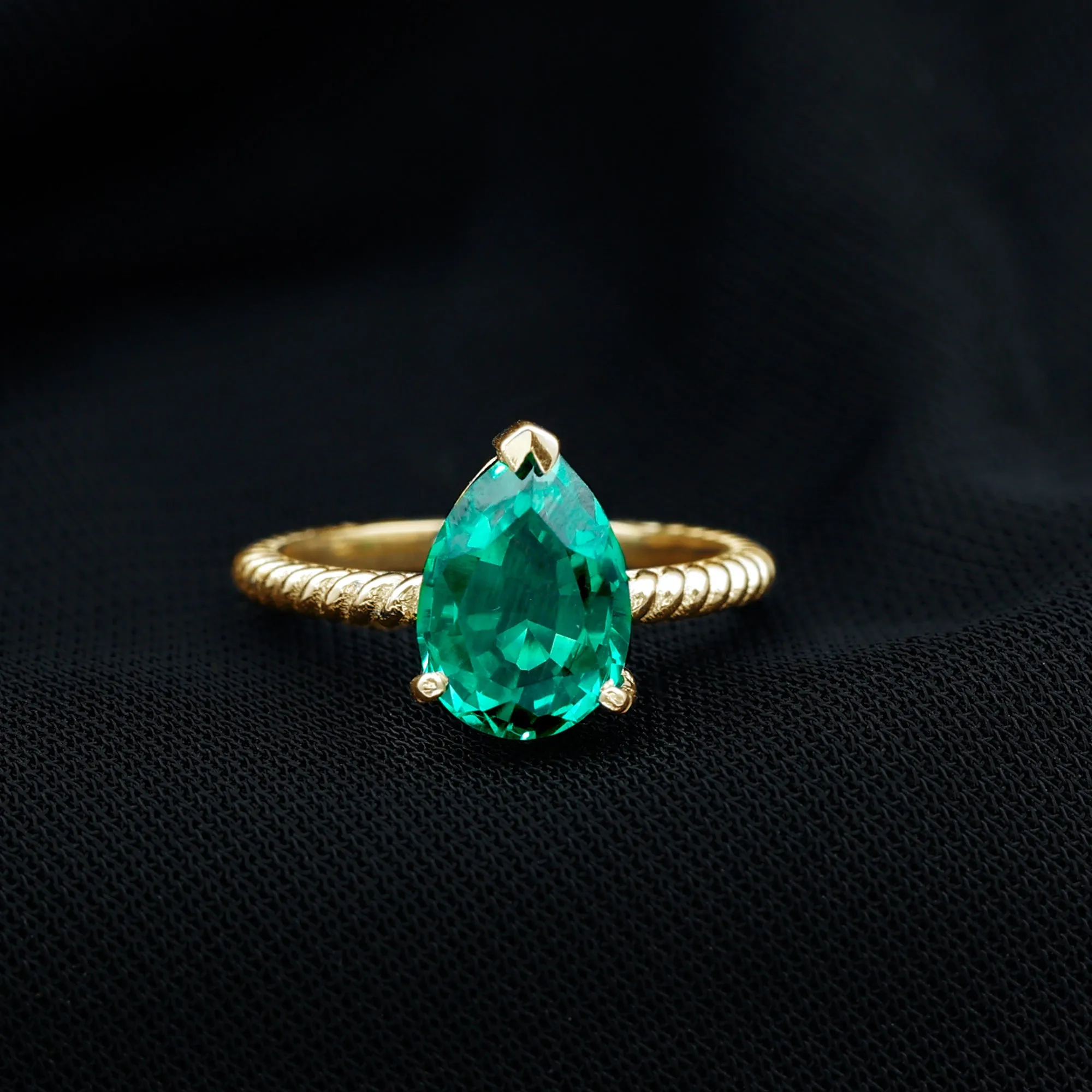 Created Emerald Solitaire Teardrop Ring with Hidden Moissanite