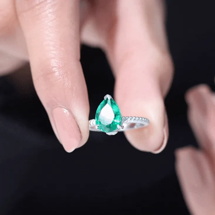 Created Emerald Solitaire Teardrop Ring with Hidden Moissanite