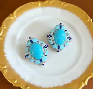Large statement size pierced turquoise style earrings.