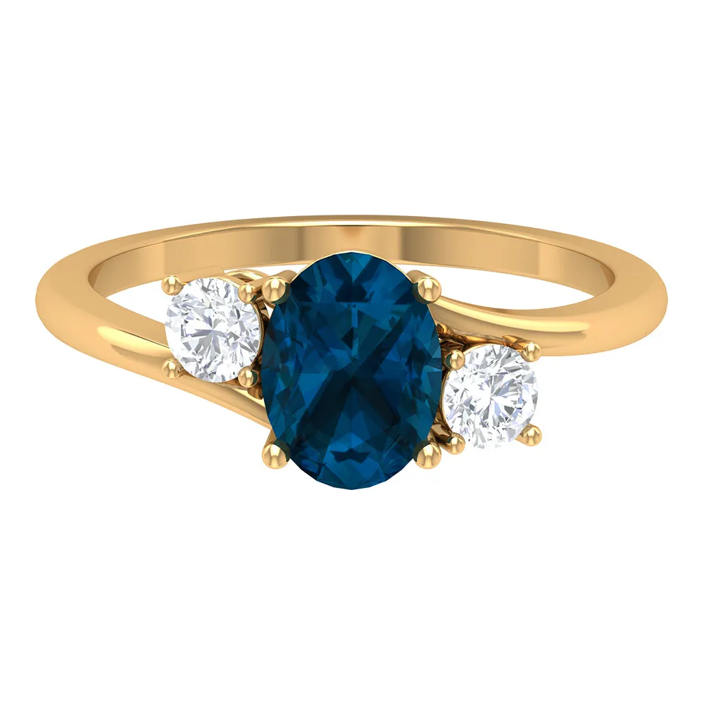 London Blue Topaz Solitaire Bypass Ring with Diamond Side Stones