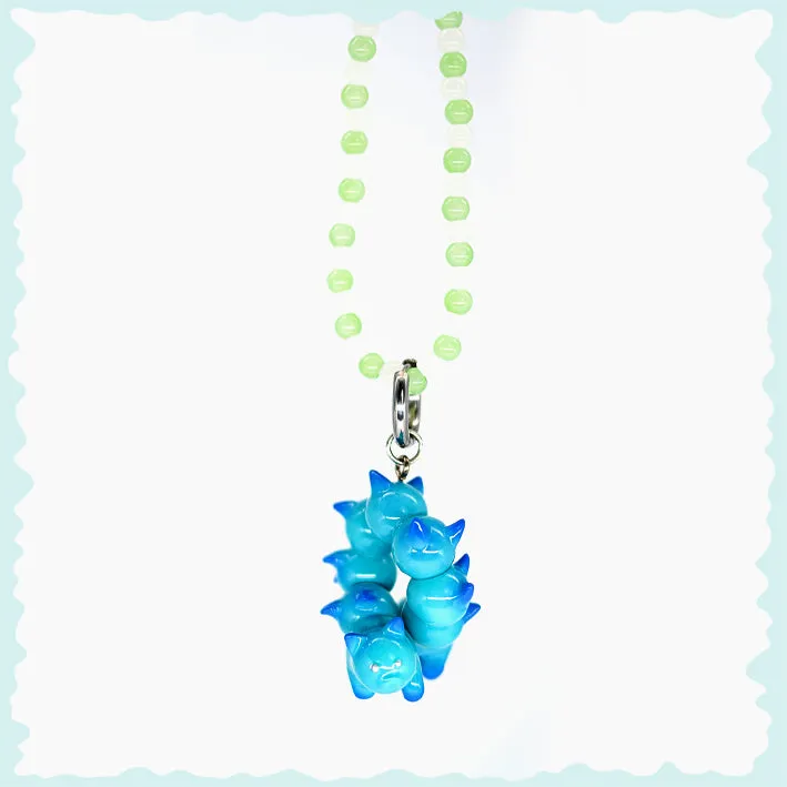 Turquoise and blue catcaterpillar with lots of ears necklace & earring